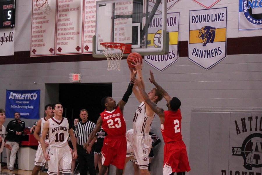 Senior Kevin Tebbe goes for a layup against the Warhawks.