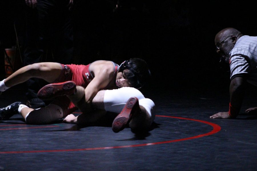 Danny McPherson pulls his opponents leg in to work a cradle in his match against the Grant Bulldogs