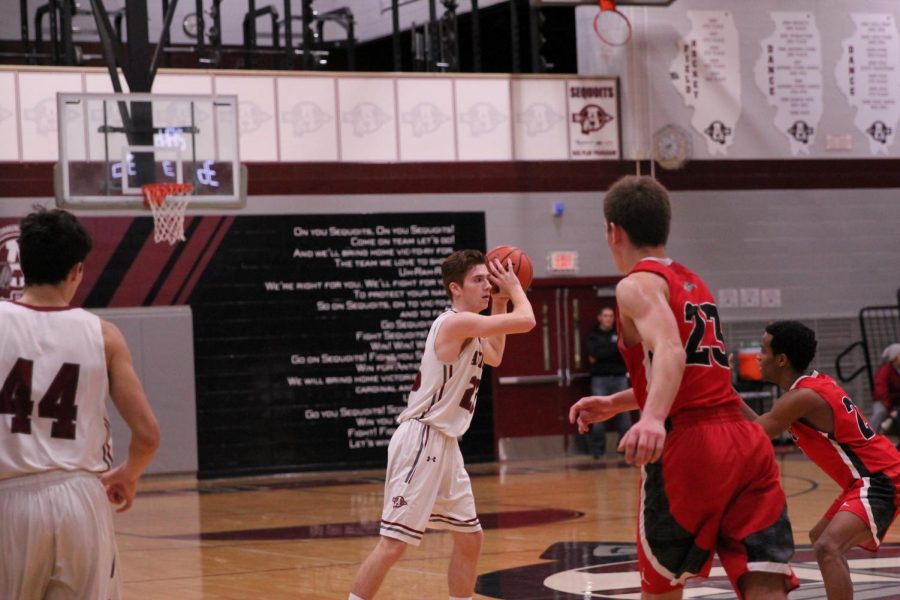 Robert Christiansen looks to pass in the game versus Grant.