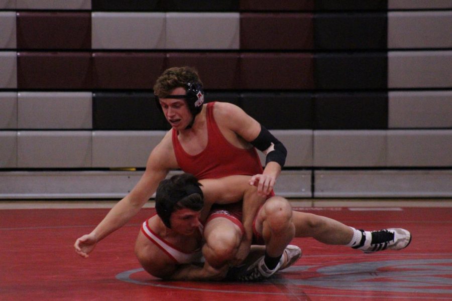 Sophomore Gavin Calabrese attempts to escape his opponent in order to score against him.
