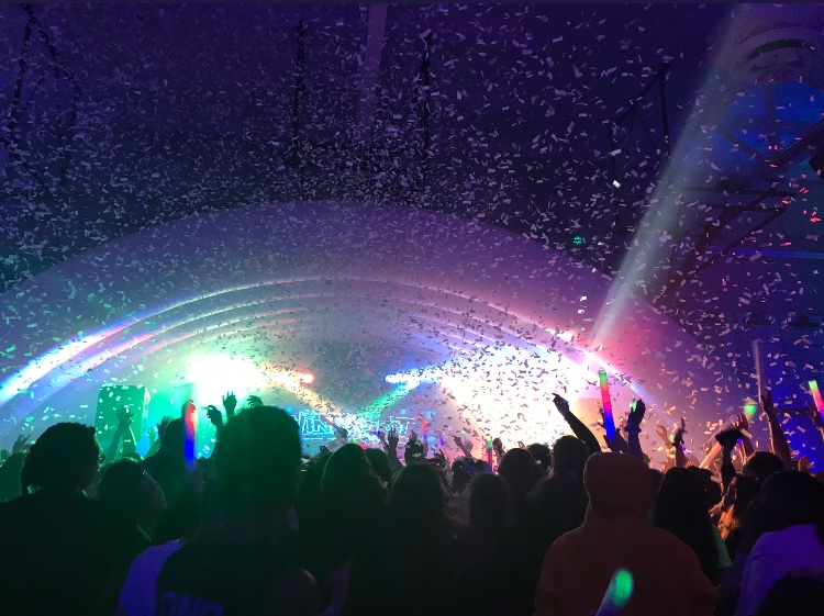 The+north+gym+was+transformed+into+multiple+DJ+stages+and+activity+stations+for+the+Winterfest+attendees+to+enjoy.+At+the+end+of+the+night%2C+the+confetti+cannons+showered+neon+paper+strips+and+rained+down+on+the+students.