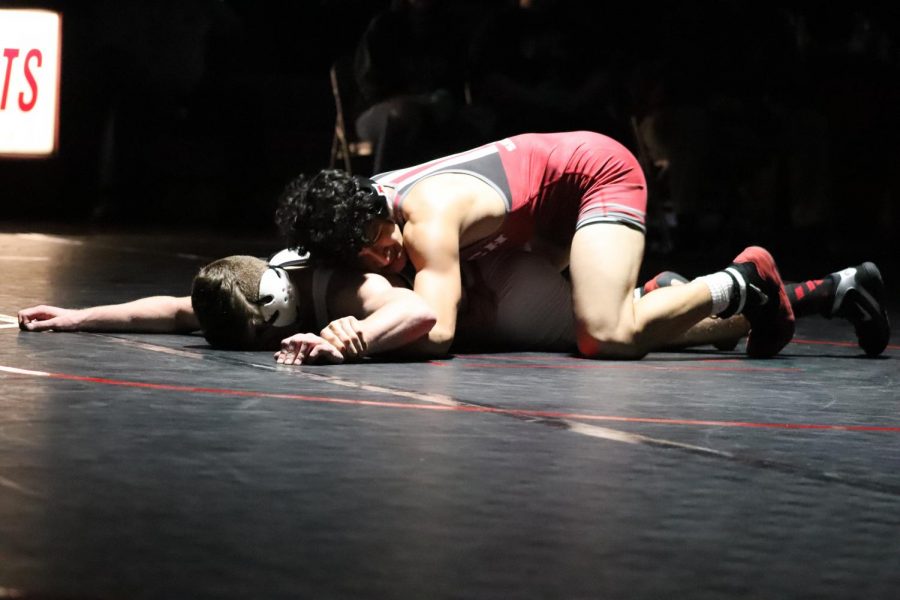 Elijah Reyes pins the competition on his way to state. 
