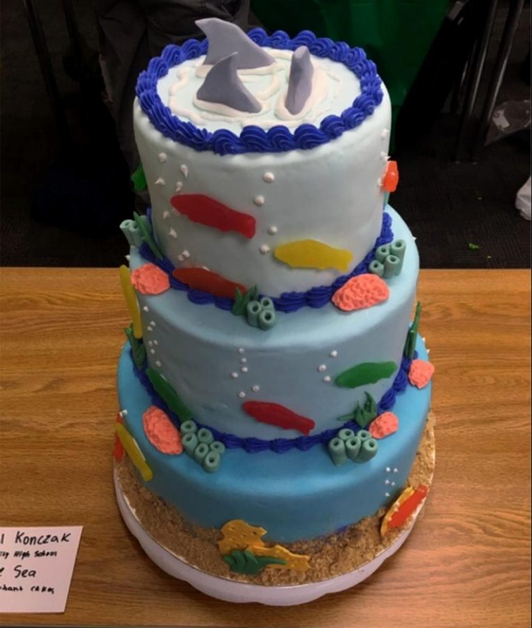 Junior Rachel Konczak creates a birthday cake inspired by the sea for sectionals.
