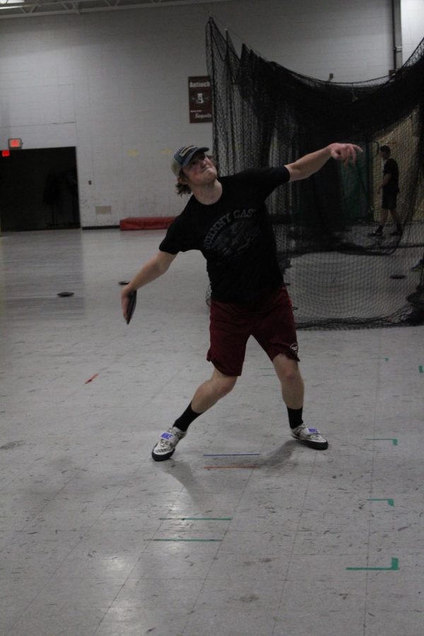 Senior Matt Becker practices discus throw