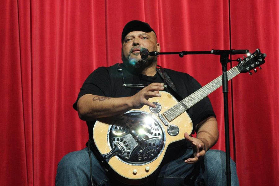 Kevin Burt preforms and talks about the blues during his presentation at ACHS.