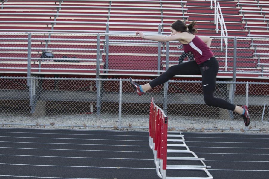 Jada Shaputis runs the hurdles at the Sequoits home track. 