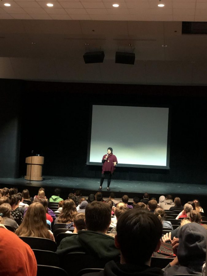 Lily Be shares her story with a crowd of interested students.