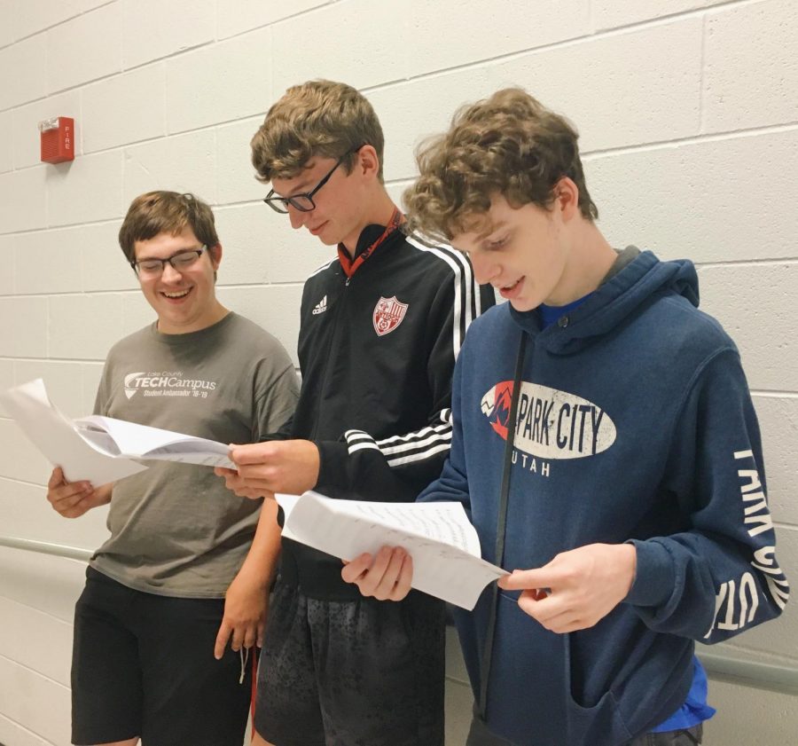 Joseph Brown, Nicholas Taylor, and James Taylor are rehearsing their song for HarMENy. 