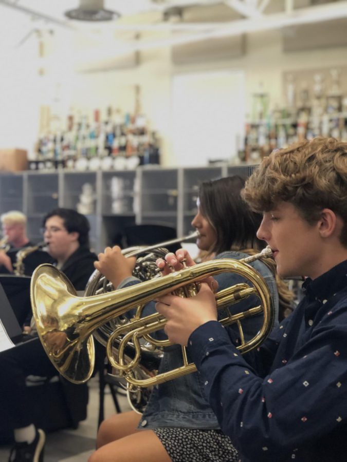 Sophomores Mark Deutschmann and Delilah Hately are practicing their cornets to get ready for their upcoming performances.
