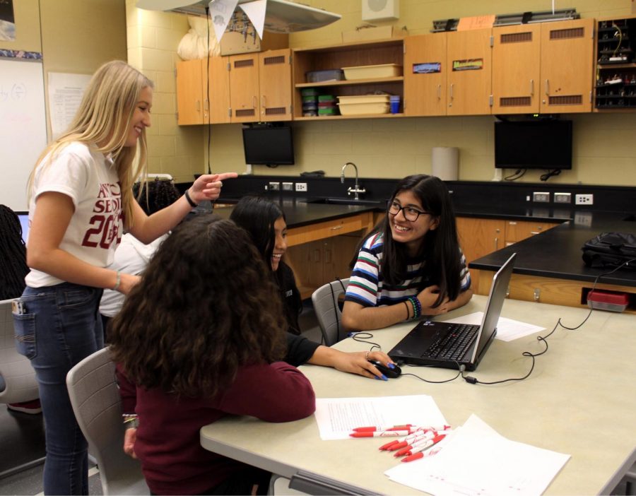 One+of+the+classes+the+girls+took+part+in+was+creating+their+own+app.+Junior+Lindsey+Lubicz+volunteered+and+helped+during+the+process.