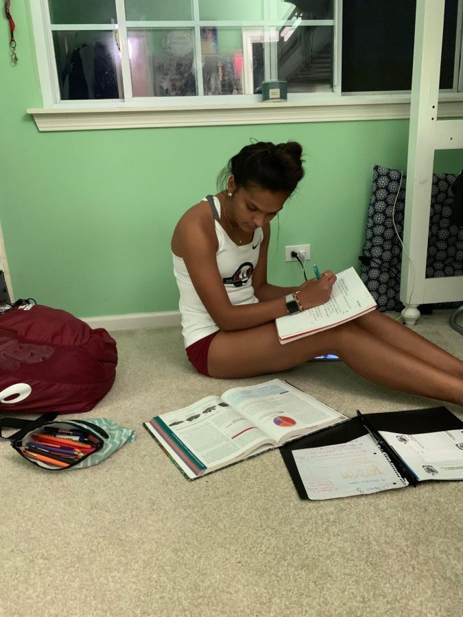 After spending multiple hours in the school and running miles in a cross country race, athletes use the remainder of their time doing homework.