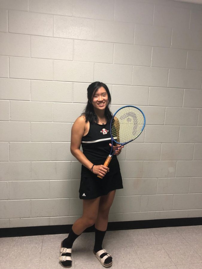 Sophomore varsity player Samantha Sy, getting ready to board the bus on the way to a game. Bus rides are just one of the bonding activities the athletes participate in. No matter who they are playing, the team will give 100 percent and play hard throughout the match.