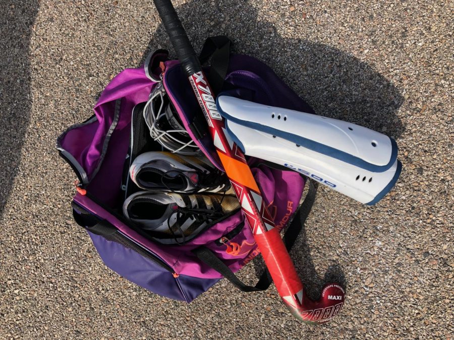 Senior Mikayla Holway shows the contents of her field hockey bag.
