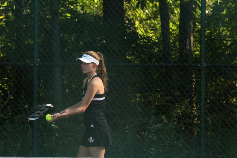 Seinor Jensen Horner gets ready to serve at the Lakes match Thursday September 26th.