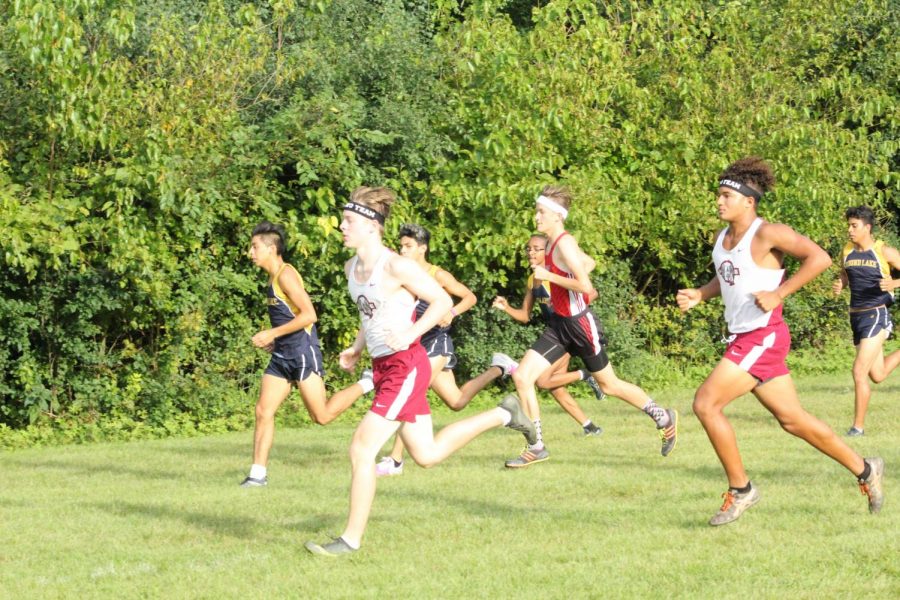 Juniors Owen Lane and Kyle Miller pushing through the last stretch of the race. 