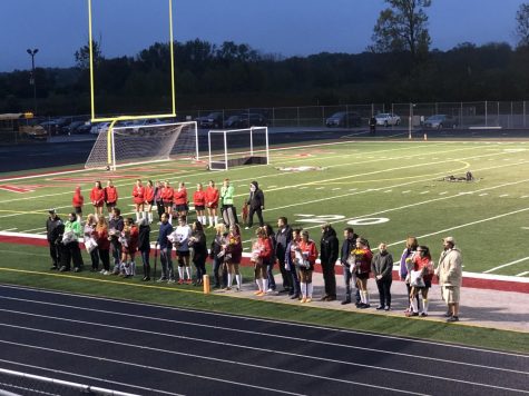 The team gathers during Senior Night to celebrate the Seniors last year on the team. There are nine seniors in the Field Hockey program. They ended the night successfully with a win.