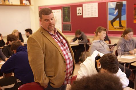 Principal Eric Hamilton observes a classroom as an effort to keep in touch with his students.