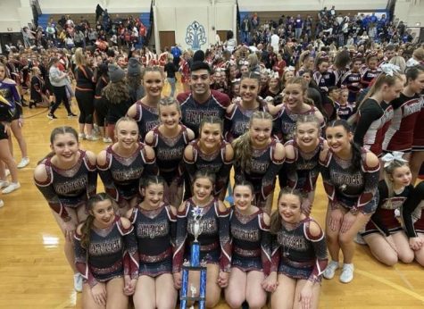 The Antioch varsity cheer team takes a picture with their second place trophy, that they won at Lake Zurich.