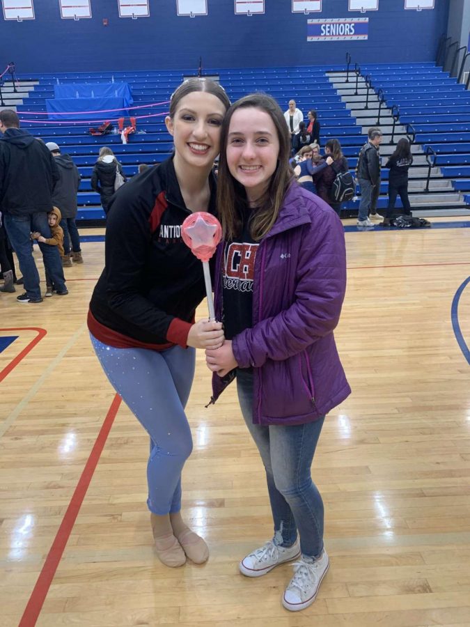 Junior Kelsi Sheren holds the spirit stick after an amazing competiton. 