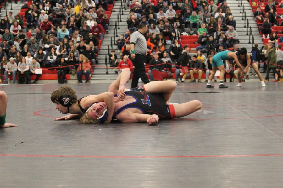 Luke Menzies takes out Lakes Community High Schools 126 varsity wrestler to move on to state.