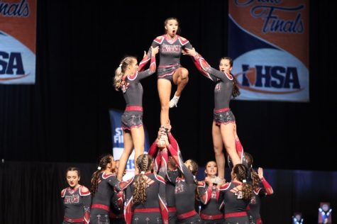 Middle flyer, Kaitlyn Bargamian hits her extended lib in the pyramid.