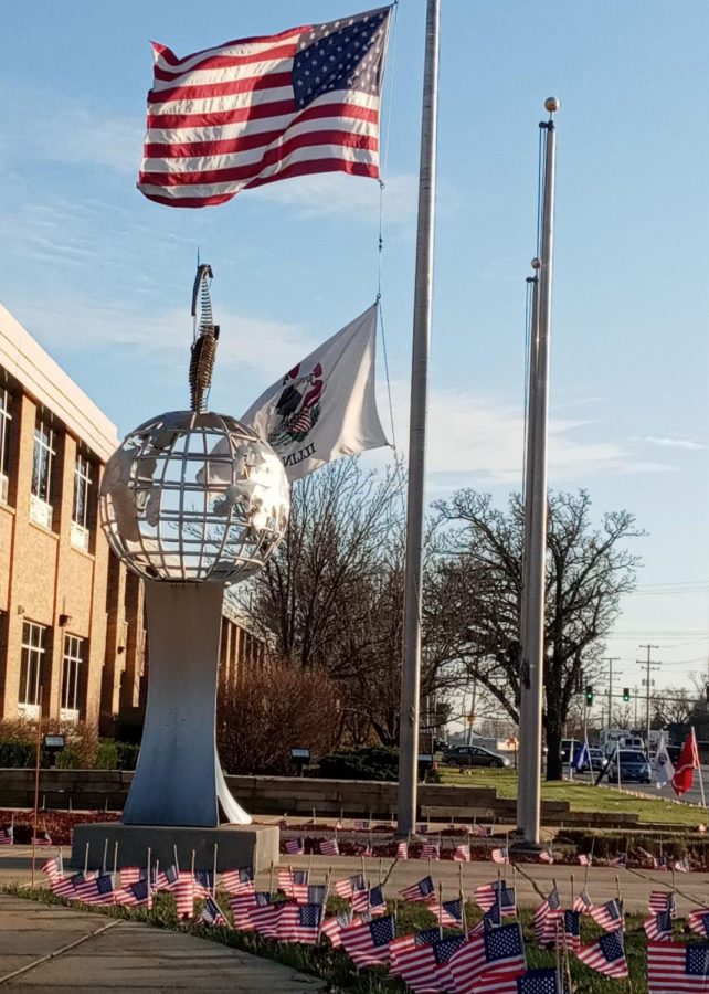 Staff+and+students+met+last+week+to+place+800+small+American+flags+around+the+high+schools+campus.