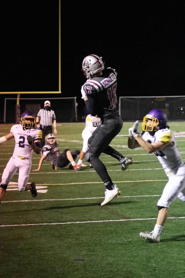 Senior Athan Kaliakmanis throws to senior wide reciever Douglas Schultz who catches the touchdwon to help the Sequoits win one of the closest games in recent Sequoit history.
