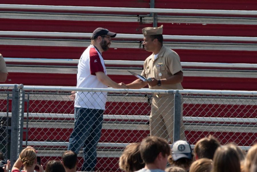 I was humbled by the whole experience. William Zambole accepts Impact Influence Award from US Navy Commander Matthew B. Roy.