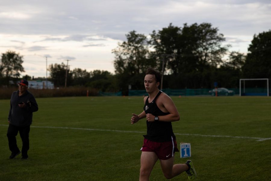 Senior Charlie Haling finishes out his third mile. 