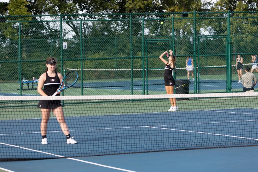 Senior Caitlynn Gsell and junior Elle Ipsen get ready to serve against Lakes. 