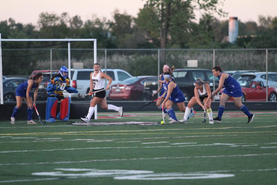 Seniors Katie Quirke and Faith Lacerba approach the goal in the Antioch vs Lakes field hockey game.