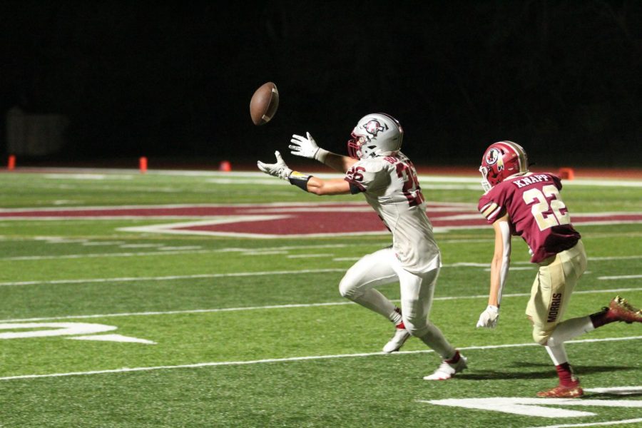 Senior Andy Bowles reaches for a pass in an attempt to make a fourth quarter comeback.