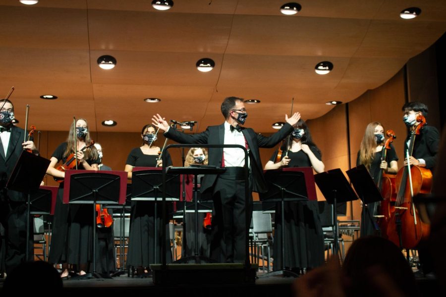 Orchestra Director Michael Riggs soaks in the applause as ACHS welcomes back band concerts