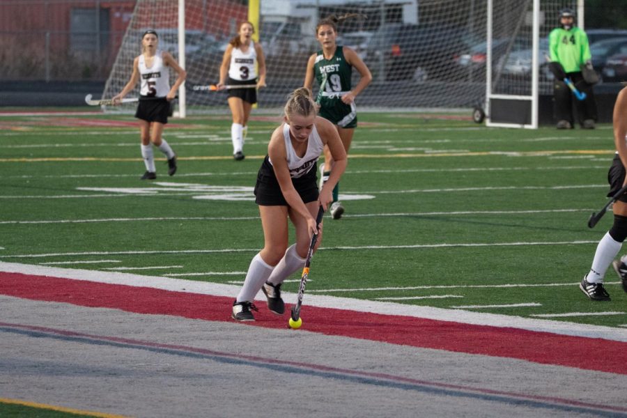 Sophmore Jasmine Fisher dribbles the ball up the line against Glendbard West.