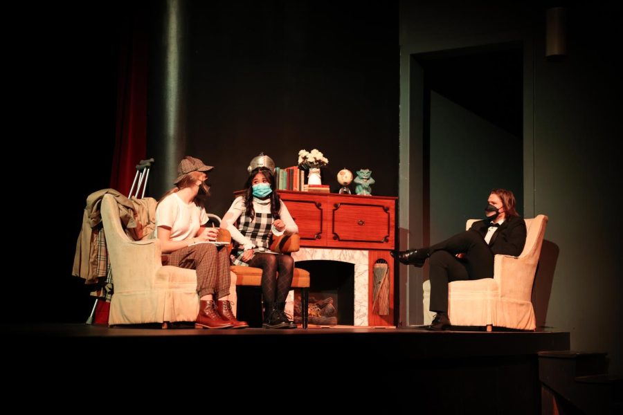 Sophomore Riley Hughes and seniors Meryl Resurreccion and Jackson Highberg rehearse a scene for the play.