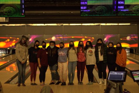 The bowling team posing during one of their meets during the season.