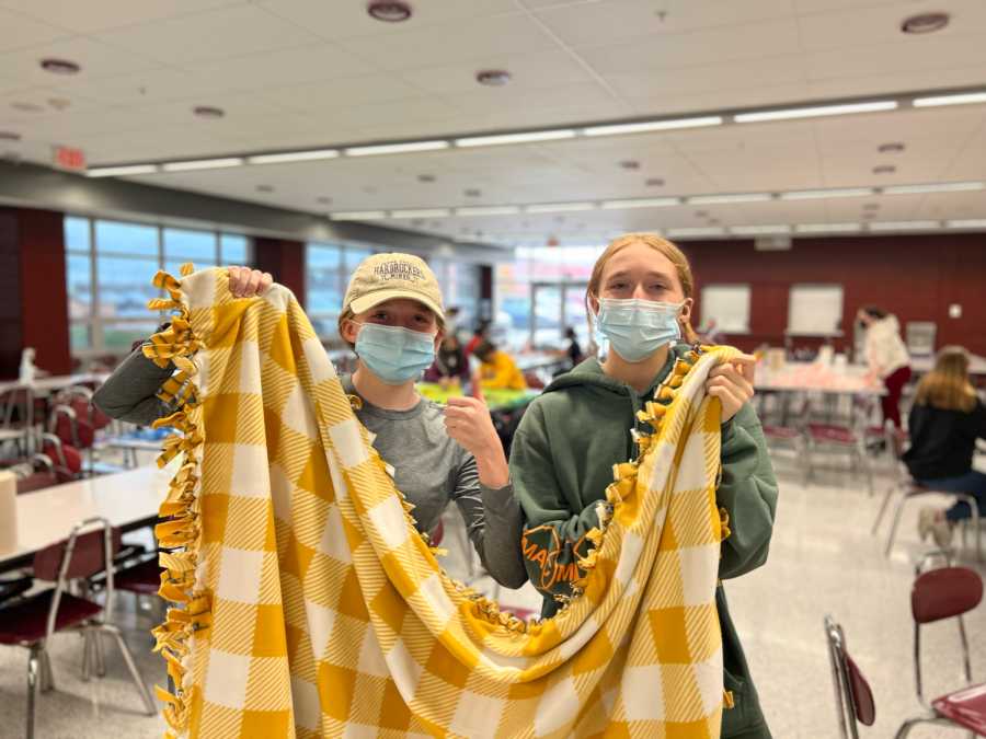 Seniors Hannah and Sarah Benes volunteer at an NHS blanket making event for The Pennys Purpose.