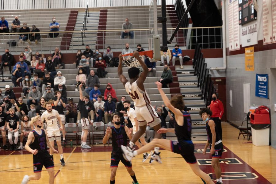 Freshman Marshall Gehrke dunks on the Lakes Eagles. 