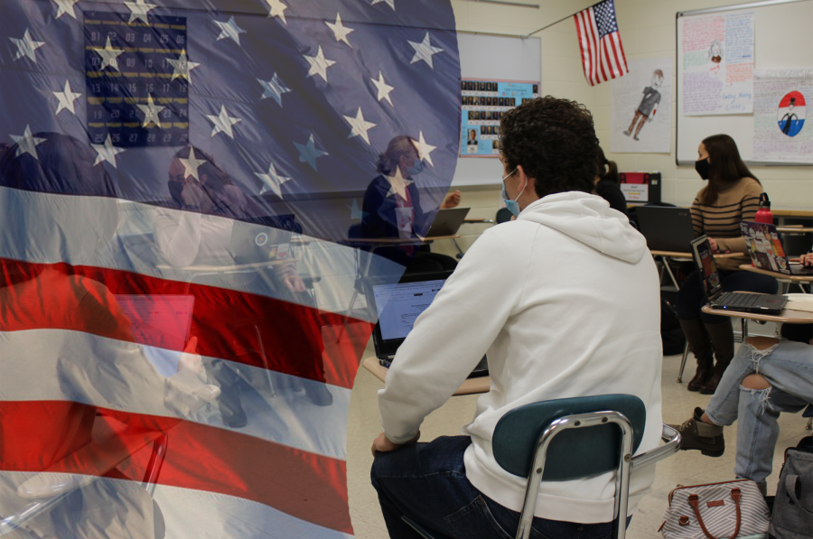 Student Democracy member, Nate Knoll listens raptly as students discuss student statistics on creating a more democratic environment.