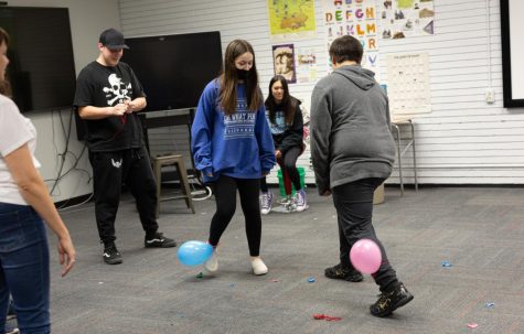 Sophomore Brooke Devience and freshman Otto Young battle to take the victory in balloon stomp.
