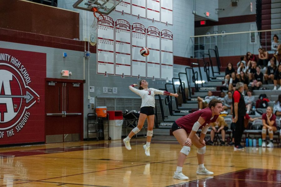 Junior Ava Yeager sets a solid serve to Marian Central.