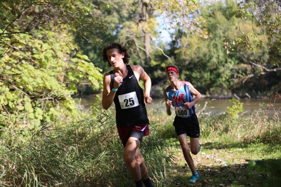 Senior Ben Georgia running his final race at his home course.