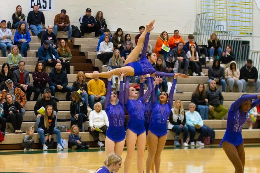Junior Kennedie Tan being lifted in the routine.