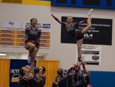 Antioch cheerleading  during their stunt sequence  at the Johnsburg High School competition. 
