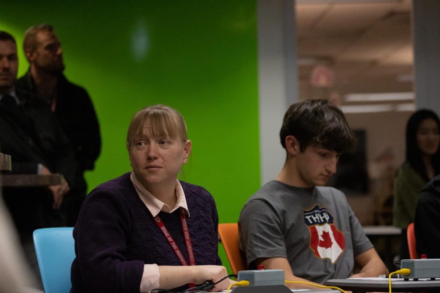 Senior Justin Pederson and  science teacher Jackie DeCaro competing in the Brain Bowl on Feb. 27.