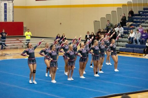The ACHS varsity cheer taking the mat at the 2023 sectionals on Jan. 28.