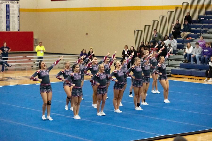 The+ACHS+varsity+cheer+taking+the+mat+at+the+2023+sectionals+on+Jan.+28.