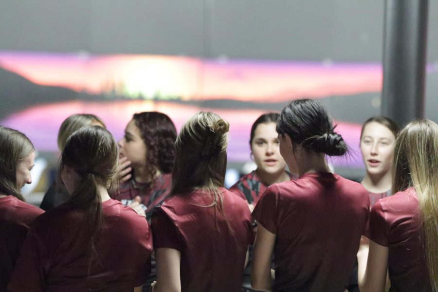 ACHS bowling team chants before beginning a match.