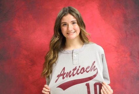 Junior Grace Green modeling the Antioch Community High School varsity softball practice uniforms.