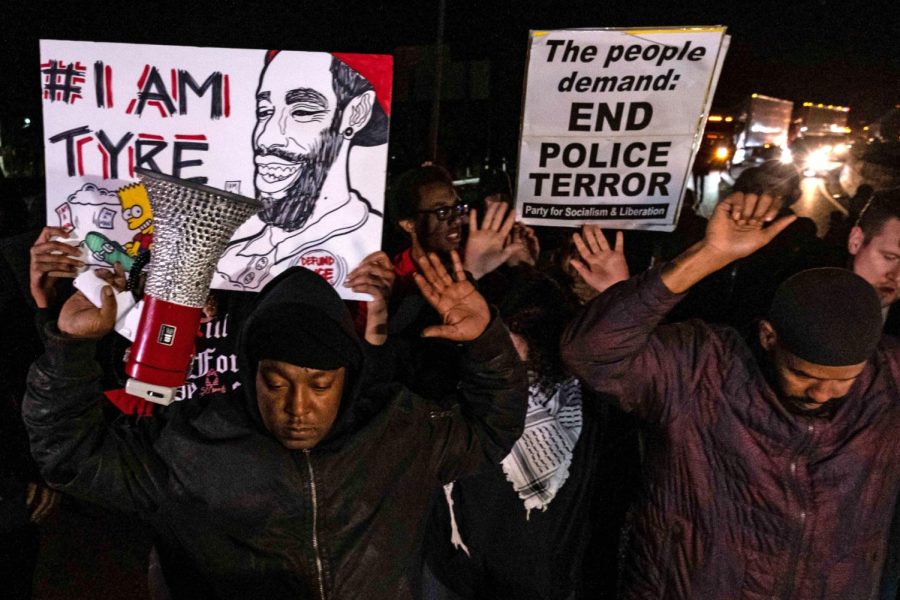 TOPSHOT - Protesters block traffic as they rally against the fatal police assault of Tyre Nichols, in Memphis, Tennessee on January 27, 2023. - The US city of Memphis released January 27, 2023 graphic video footage depicting the fatal police assault of a 29-year-old Black man, as cities nationwide braced for a night of protests against police brutality. Five Memphis officers, also all Black, were charged with second-degree murder in the beating of Tyre Nichols, who died in hospital on January 10 three days after being stopped on suspicion of reckless driving. (Photo by Seth Herald / AFP) (Photo by SETH HERALD/AFP via Getty Images)